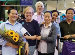 At the airport in Ho Chi Mihn City, IHMs send a final farewell to BVMs Kate Hendel (second from l.) and Teri Hadro (r. of Kate).