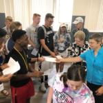 Clarke University students present letters to BVM sisters.
