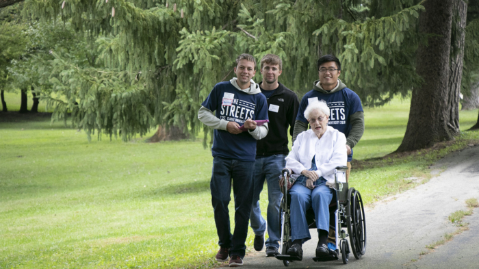 Clarke University students escort Eileen (Rose Francis) Anglim, BVM to the Mount Carmel cemetery to visit her dear friends.
